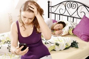 Wife checking her husband's mobile