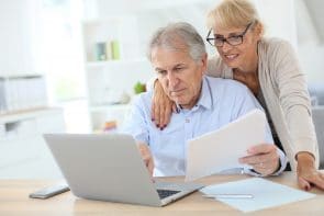 Elderly couple filling an online form