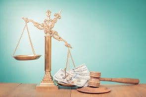 Legal scale with gavel and money